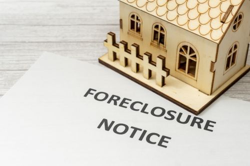 Notice of foreclosure of a house. Visual concept for a legal blog discussing the Connecticut foreclosure mediation process, and how it helps residents renegotiate mortgages, and ways to avoid losing their homes.