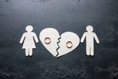 Paper family near a broken heart. Visual concept of divorce for blog discussing divorce mediation tips.