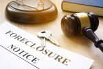 Foreclosure notice and keys on a court table. Visual concept for a legal blog discussing 3 Types of Judicial Foreclosure in Connecticut.