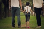 Daughters, with divorced parents were holding hands in the park. Concept for Connecticut Custody Plans: How to Pick a Visitation Plan for Your Family
